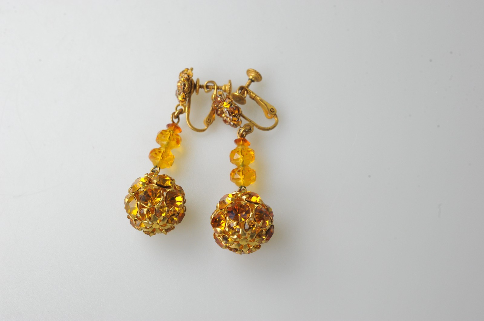 Vtg signed Miriam Haskell rhinestone Gold Tone drop clip earrings amber color