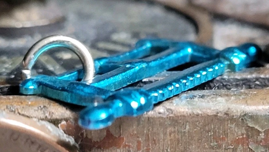 Vintage Blue Metal SAW charm prize jewelry