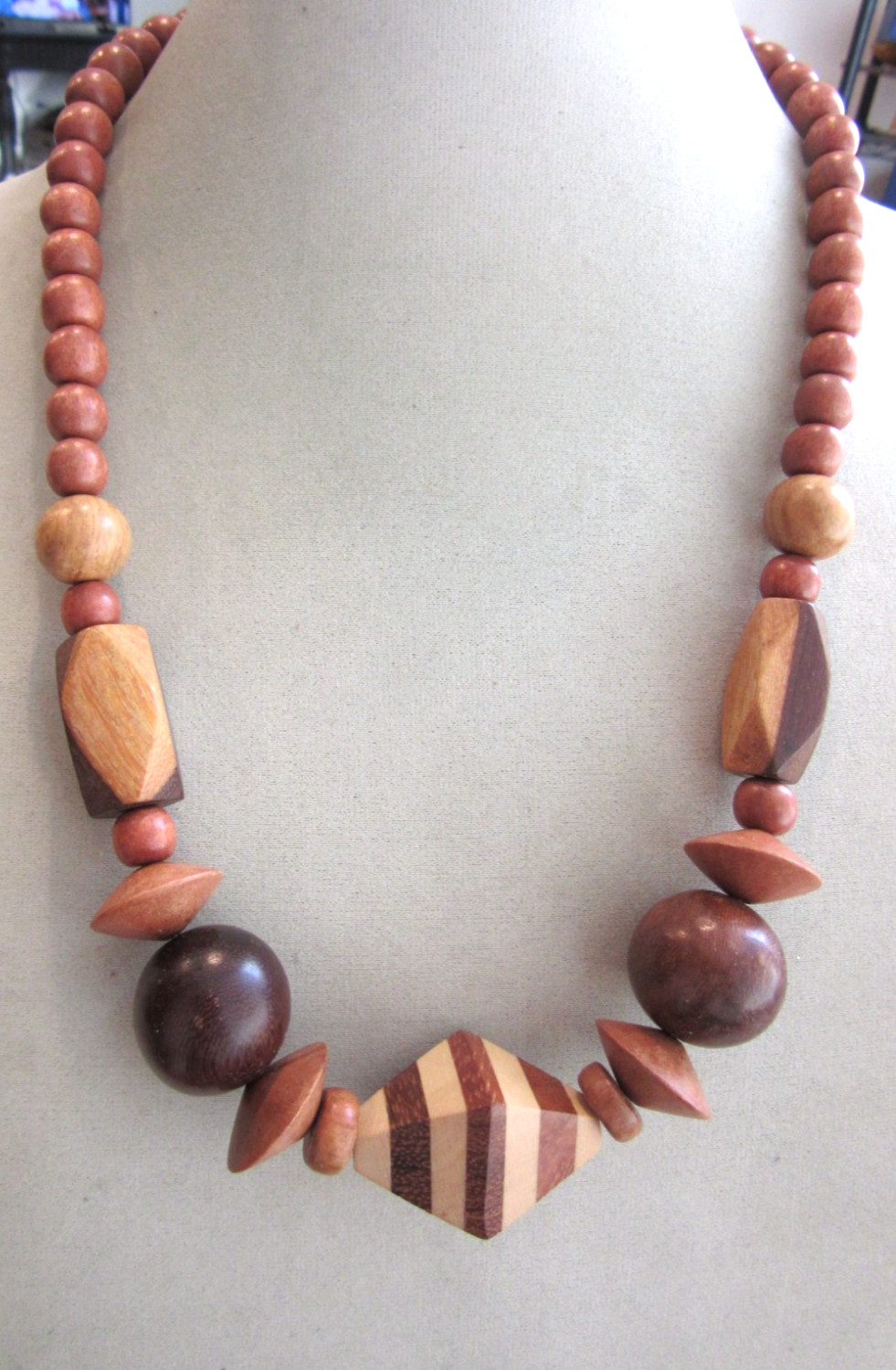 Vintage polished and faceted wood beaded necklace -22″ long