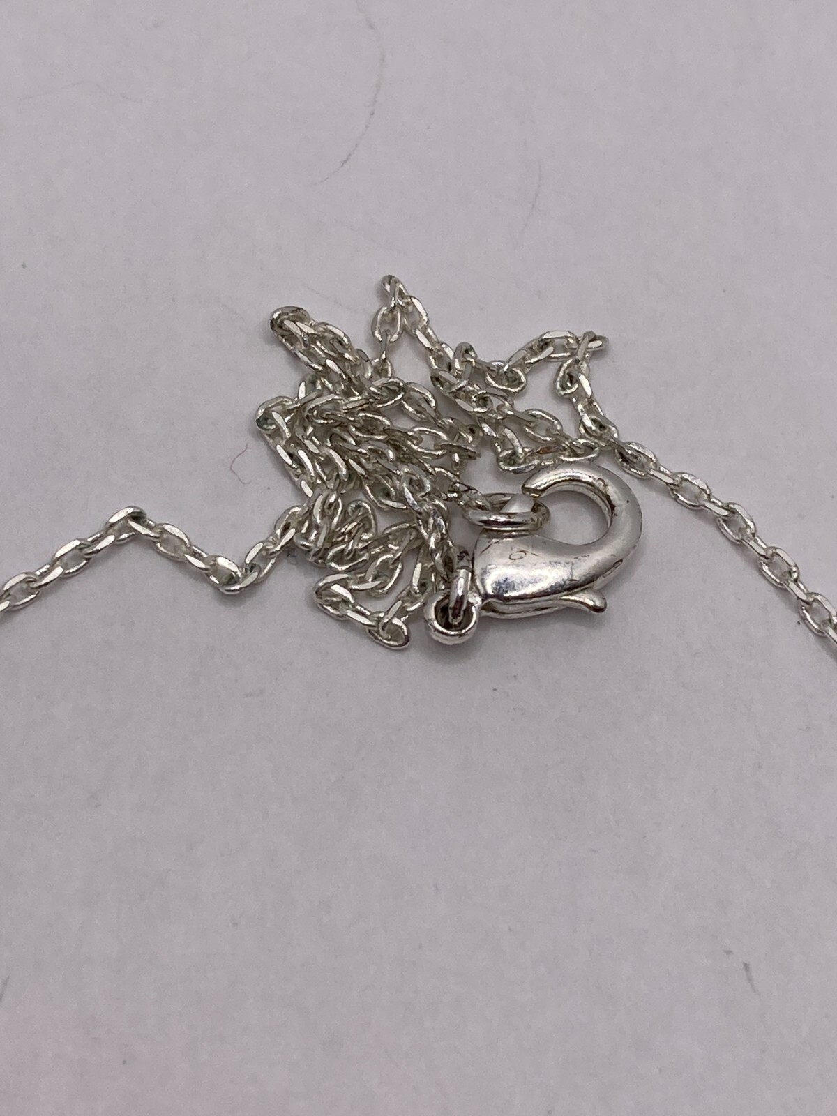 Shimmering Star-Shaped Clear Stone on Delicate Silvertone Necklace