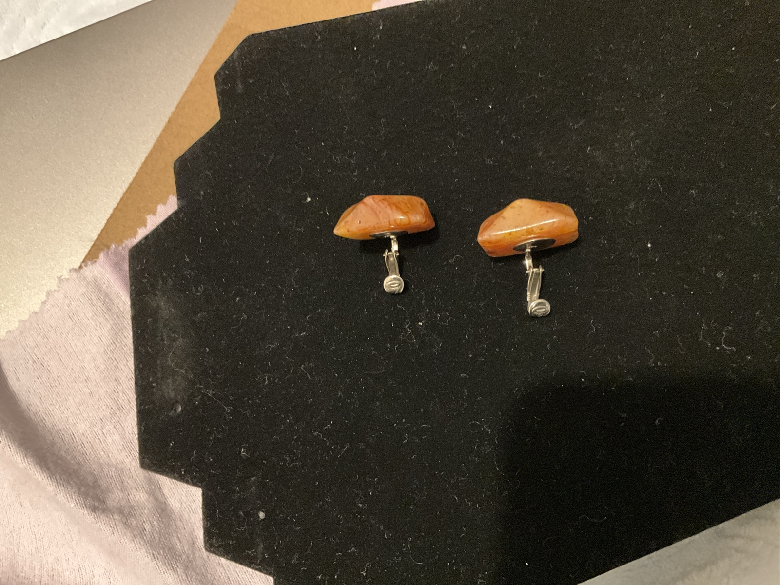 Bakelite Carved Apple Juice Clip On Earings About I 1/4 Inch Across 3/8 Thick.