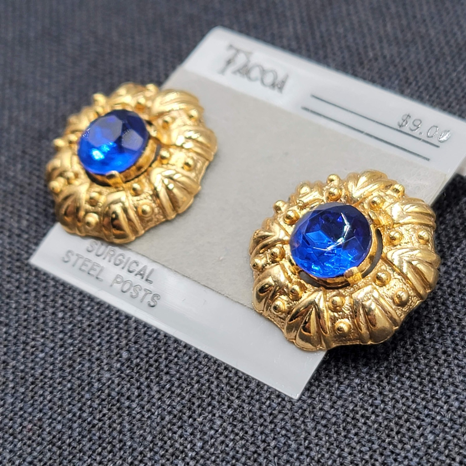 Vintage Tacoa Blue Rhinestone Pierced Earrings Embossed Gold tone NOS 1″