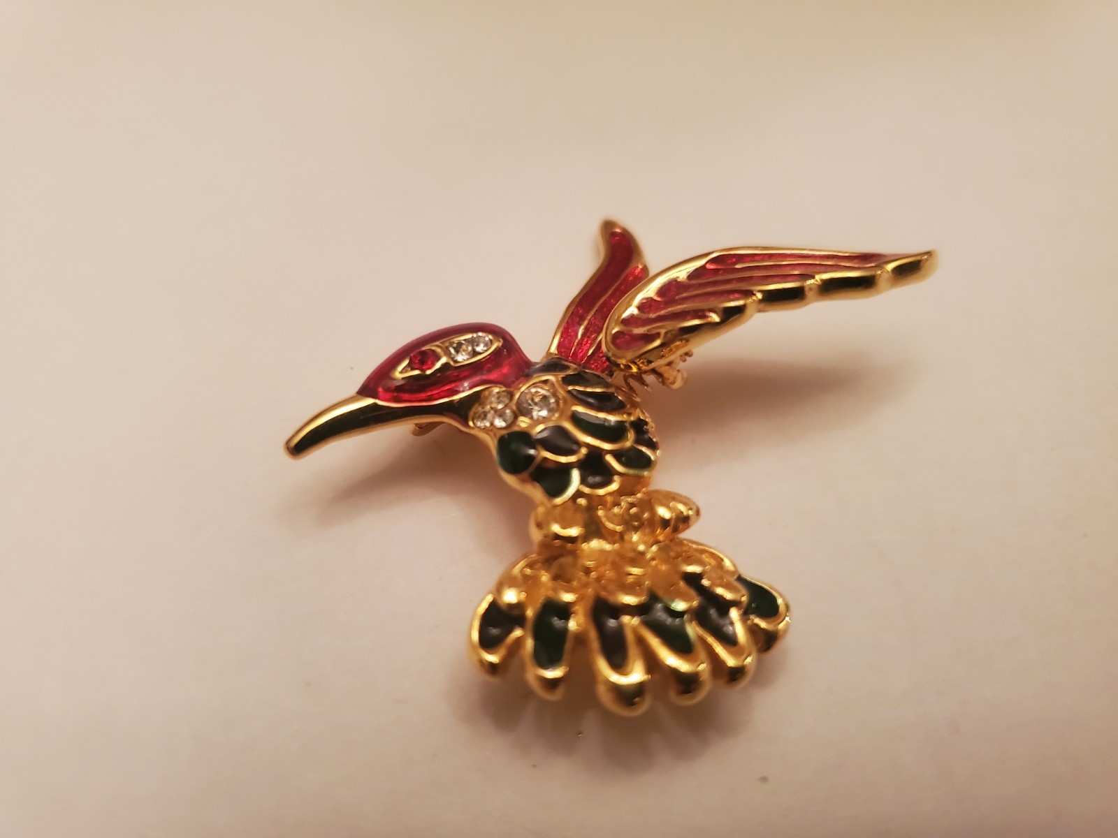 Hummingbird Brooch Features Gold-Tone Finish With Red And Black Enamel Detailing