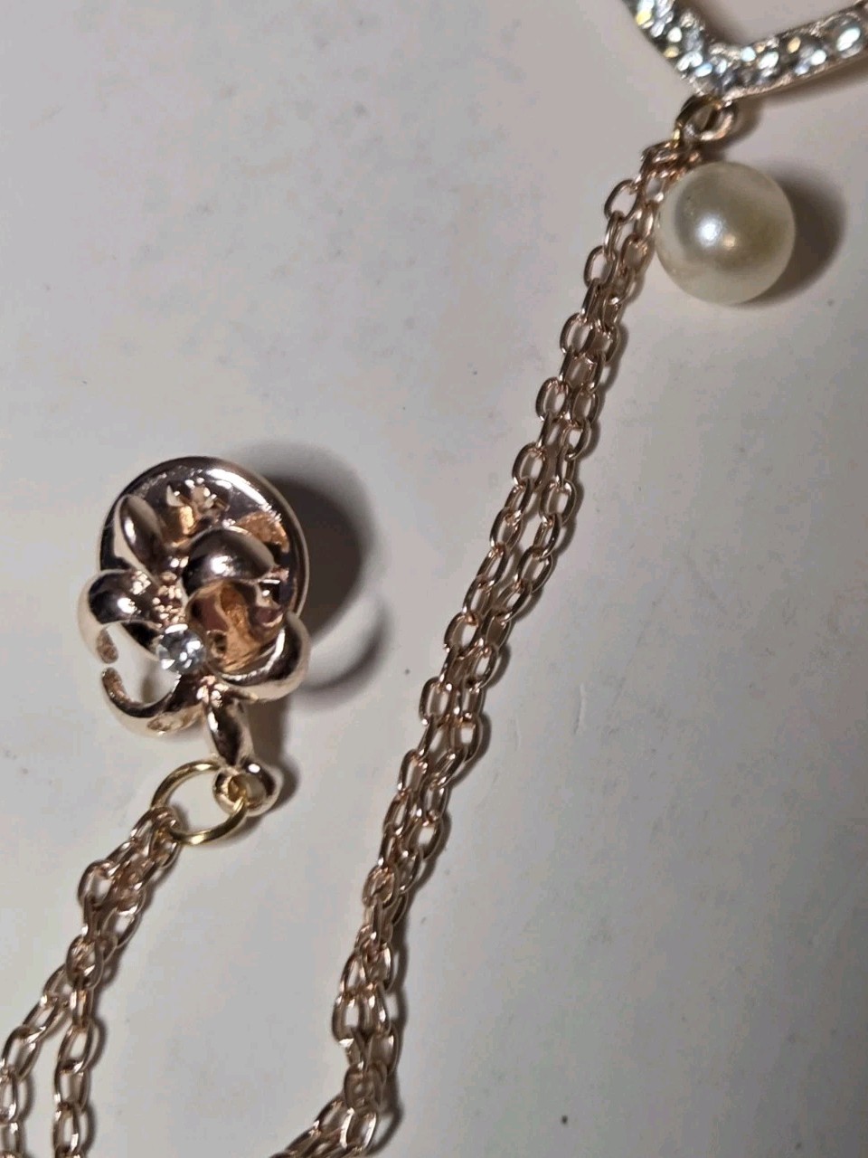 White Austrian Cyrstal Brooch In Rosetone With White Glass Pearl Wings Heart