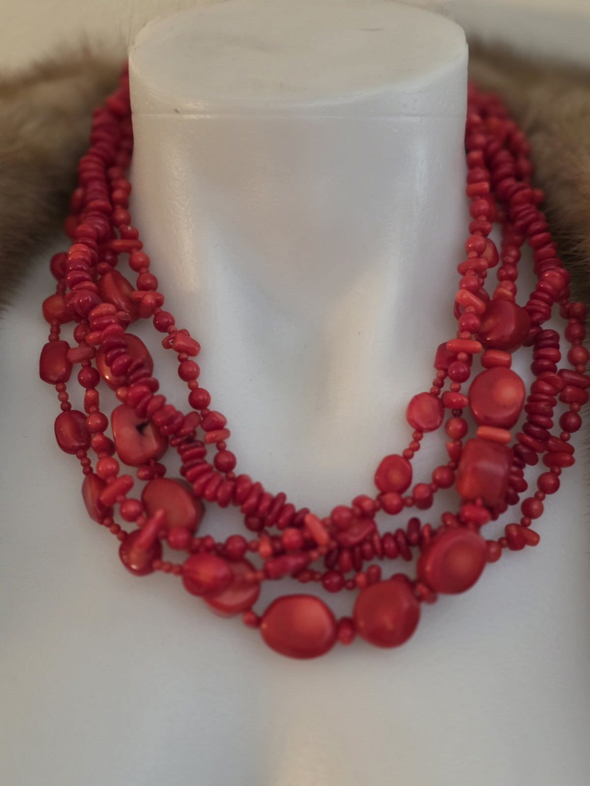 multi-strand red coral bead necklace Different shapes and sizes.