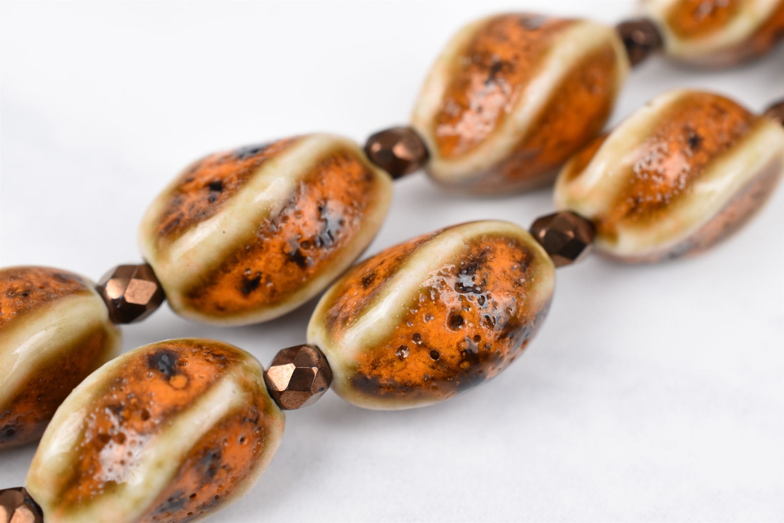 Gold Plated 21″ Cream Brown Orange Twist Ceramic Necklace w/ Bronze Spacers