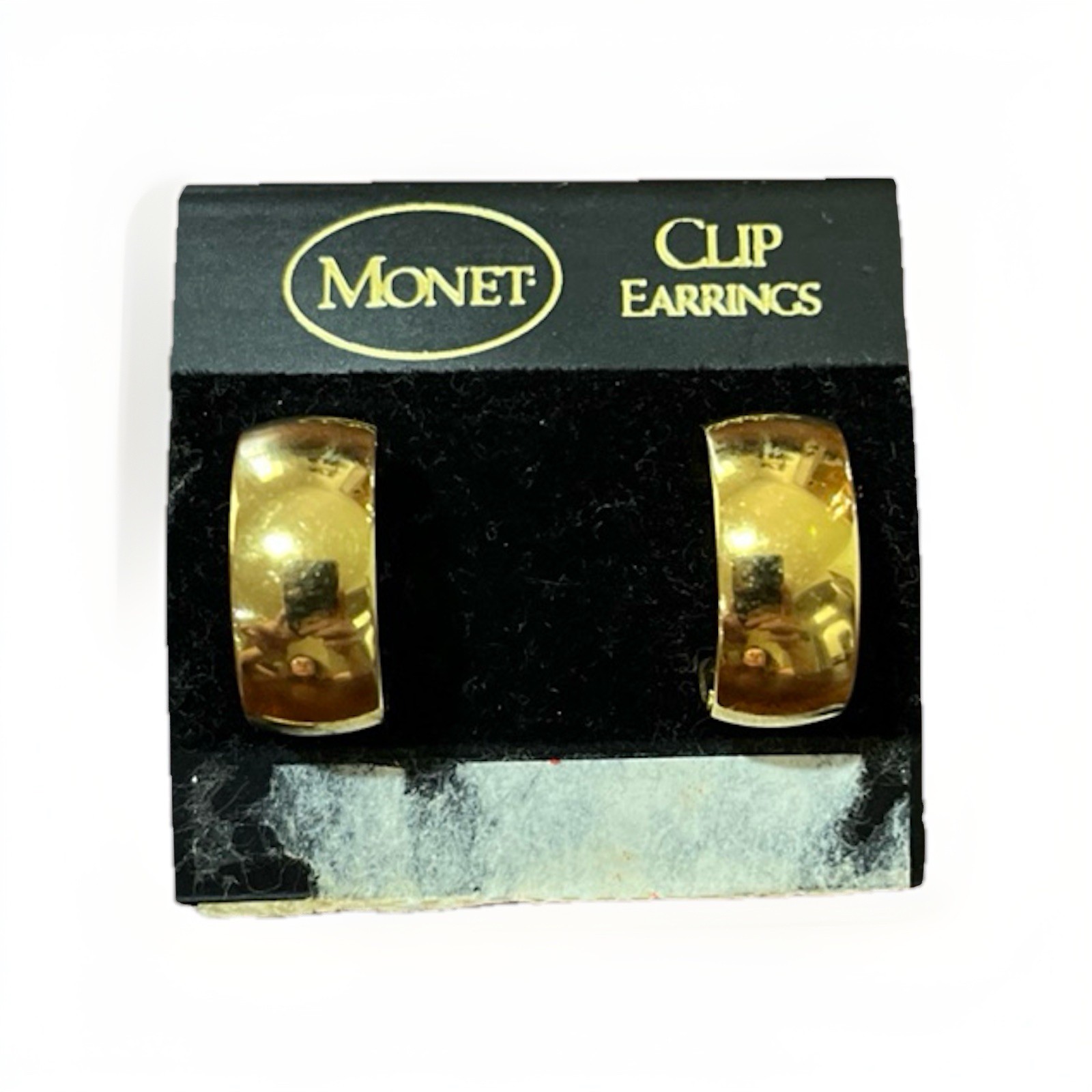 Vintage Monet wide huggie hoop clip on earrings polished gold tone finish