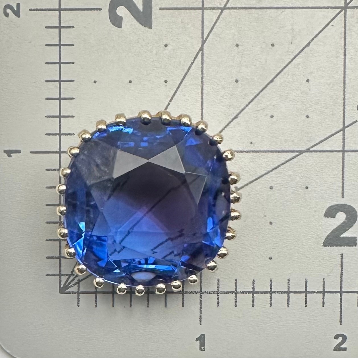 Vintage gold tone cushion cut massive blue glass rhinestone brooch pin