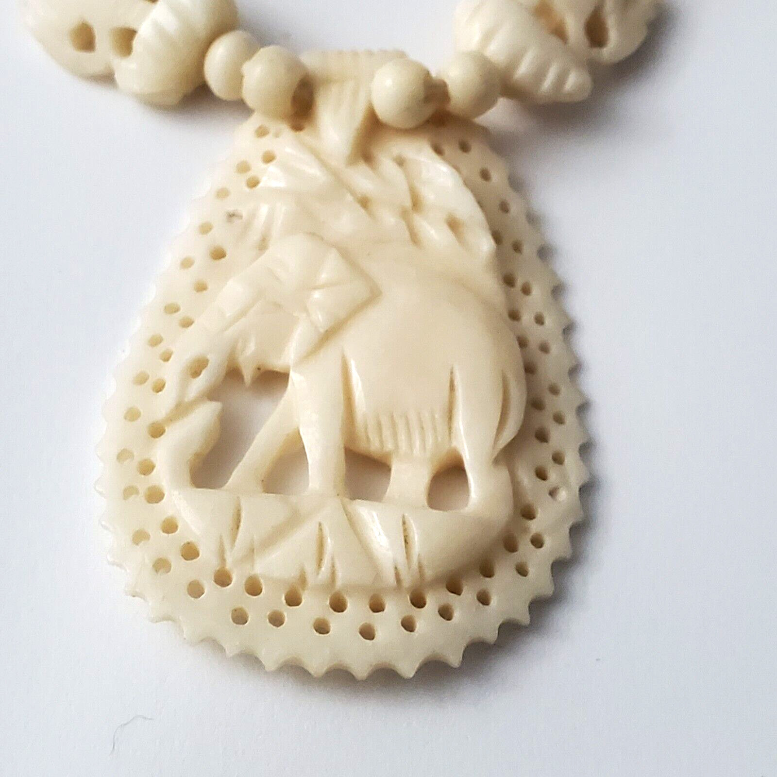 Vintage 19 3/4″ Faux Ivory Carved Celluloid/Plastic Elephant Pendant Necklace