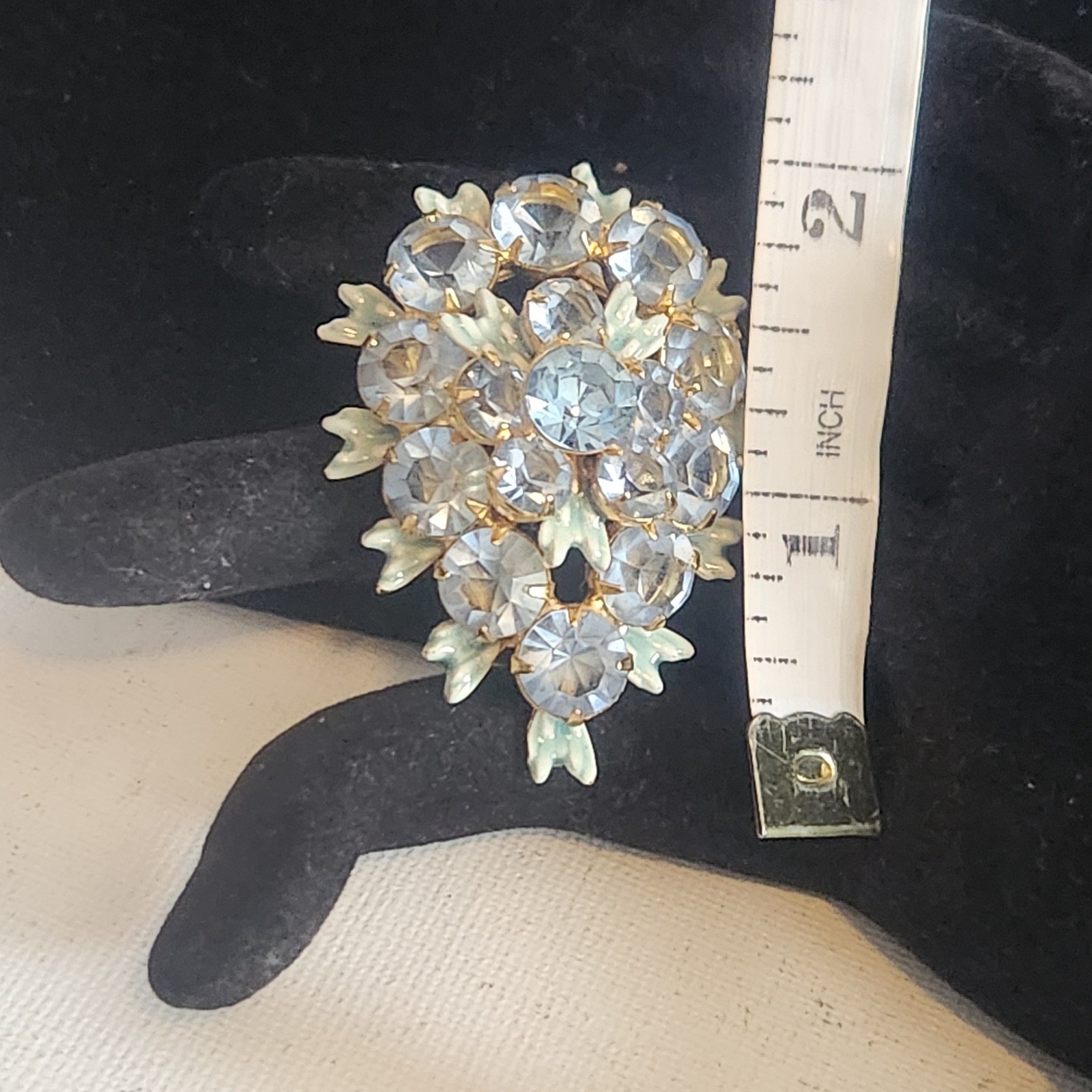 Vintage Light Blue Rhinestone Floral Cluster brooch Gold Tone Enamel Leaf Detail