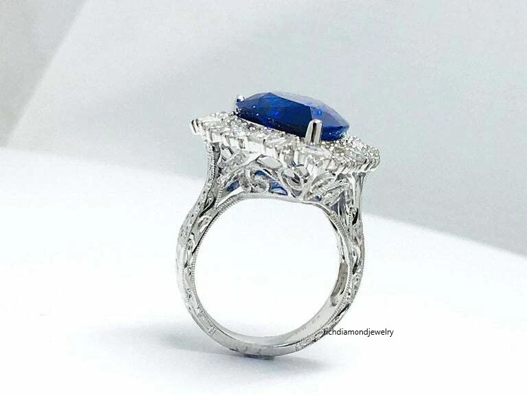 Beautiful Pear Shape 13.24CT Tanzanite & Different Shapes 3CT Shiny CZ Halo Ring