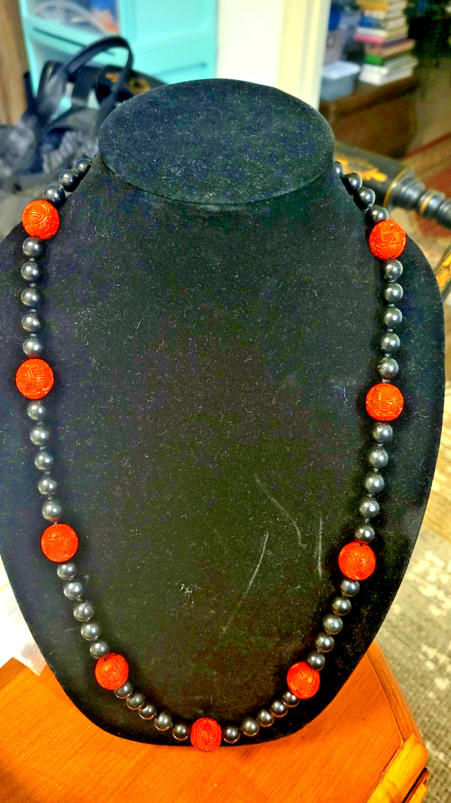 Cinnabar and black obsidion necklase 30″ hand knotted no clasp. 11 carved red lg