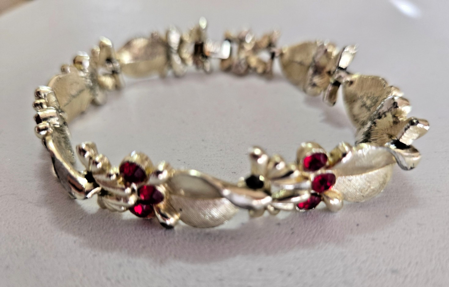 Vintage STAR Bracelet. Signed. Goldtone Setting with Red Rhinestone Accents.