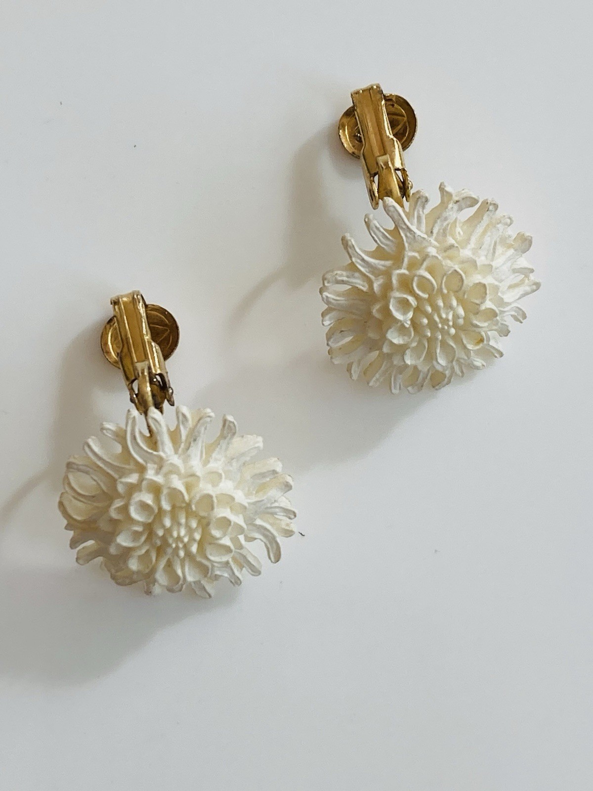 Vintage mid century MCM white celluloid floral clip on earrings
