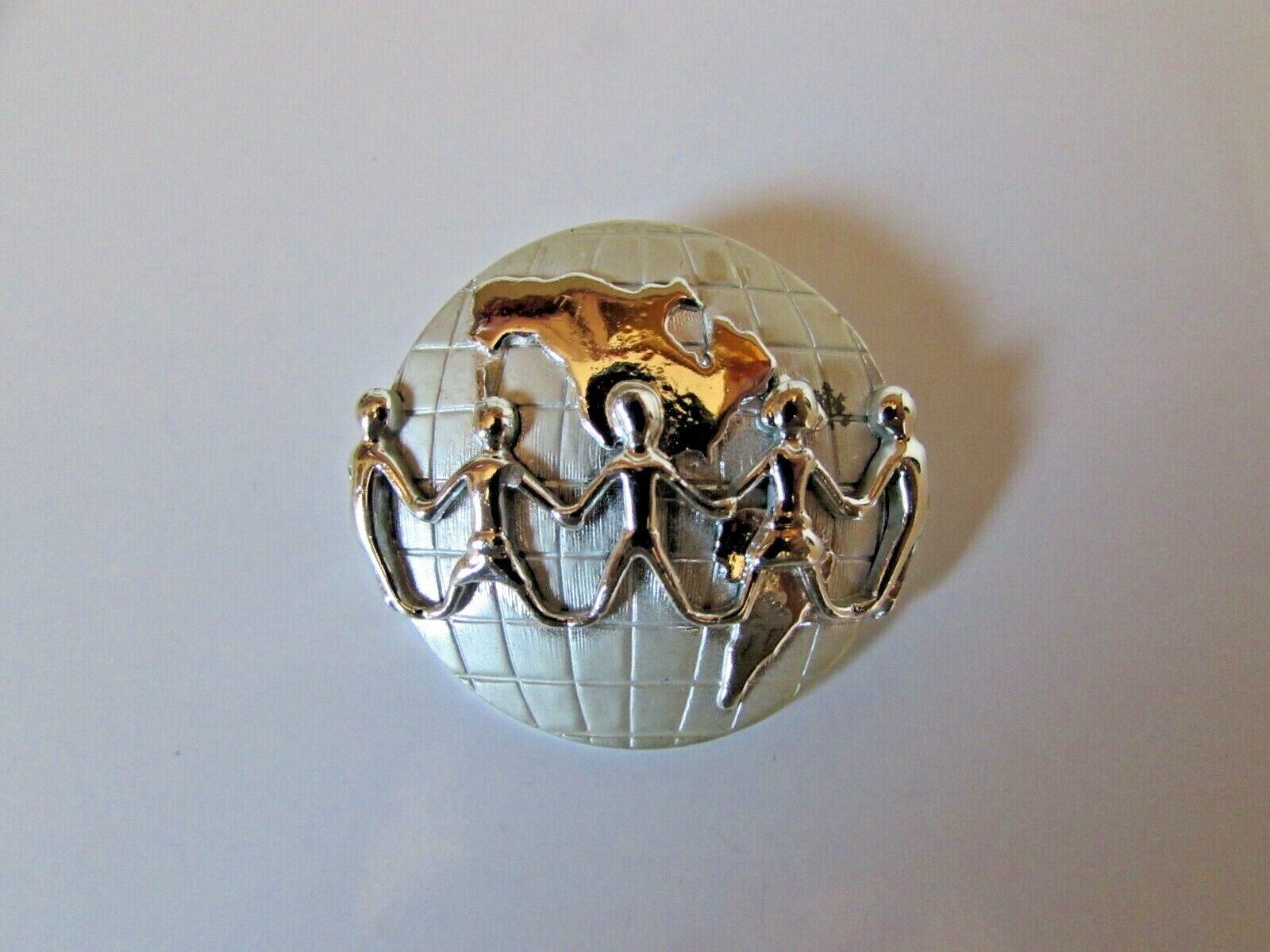 Vintage AJC Signed Silver Tone Holding Hands Across the World Brooch Pin 1 1/2″