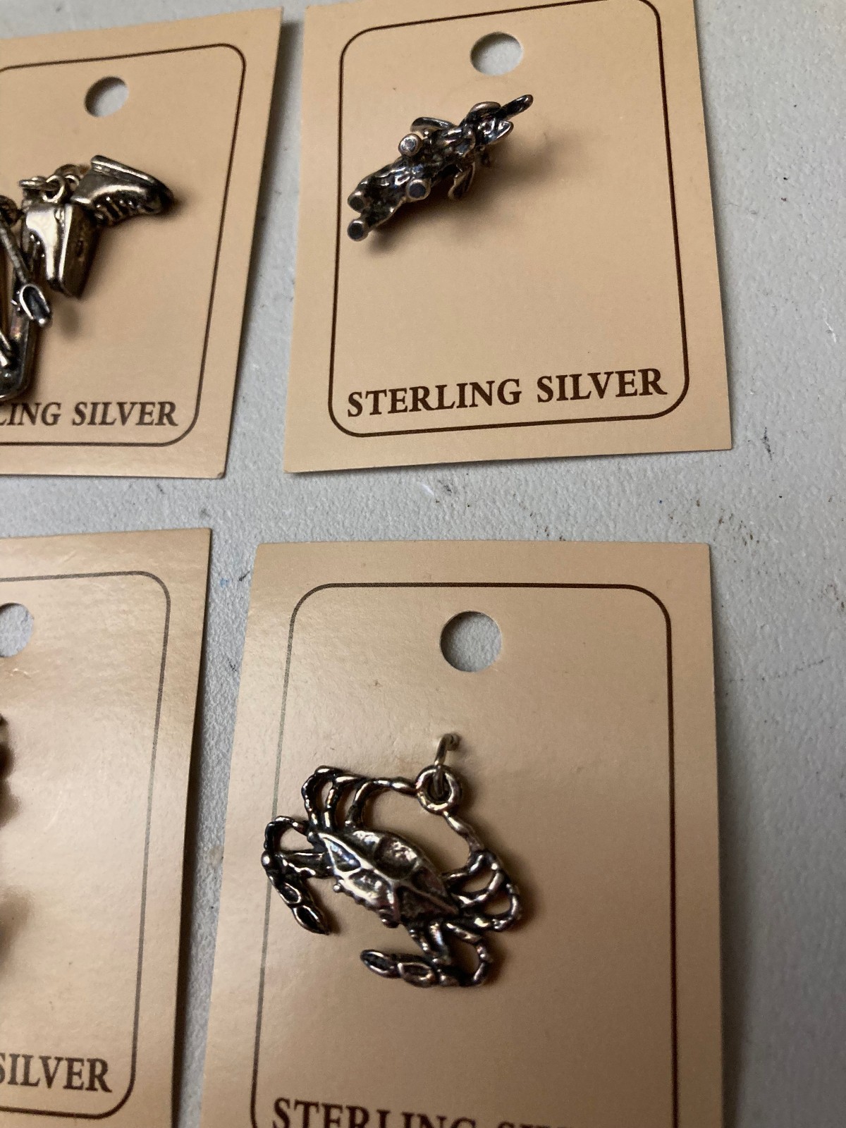 VINTAGE (10 ) DIFFERENT STERLING .925 CHARMS STILL ON CARDS N.O.S.