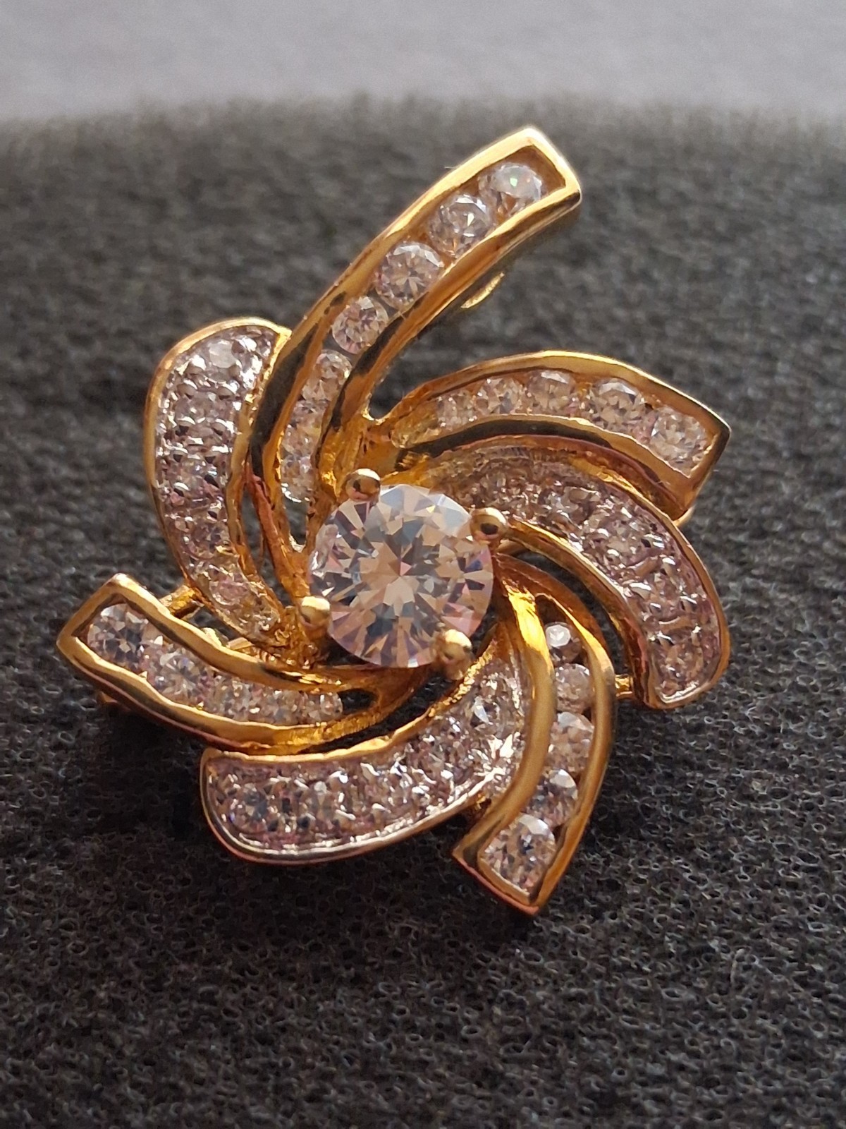 Pinwheel cubic zirconia embellished gold plated convertible brooch/pendant