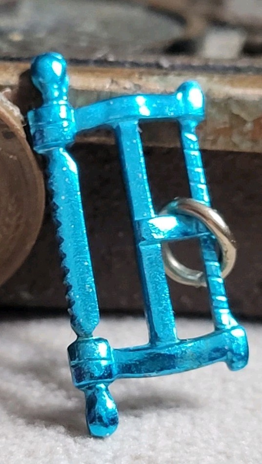Vintage Blue Metal SAW charm prize jewelry