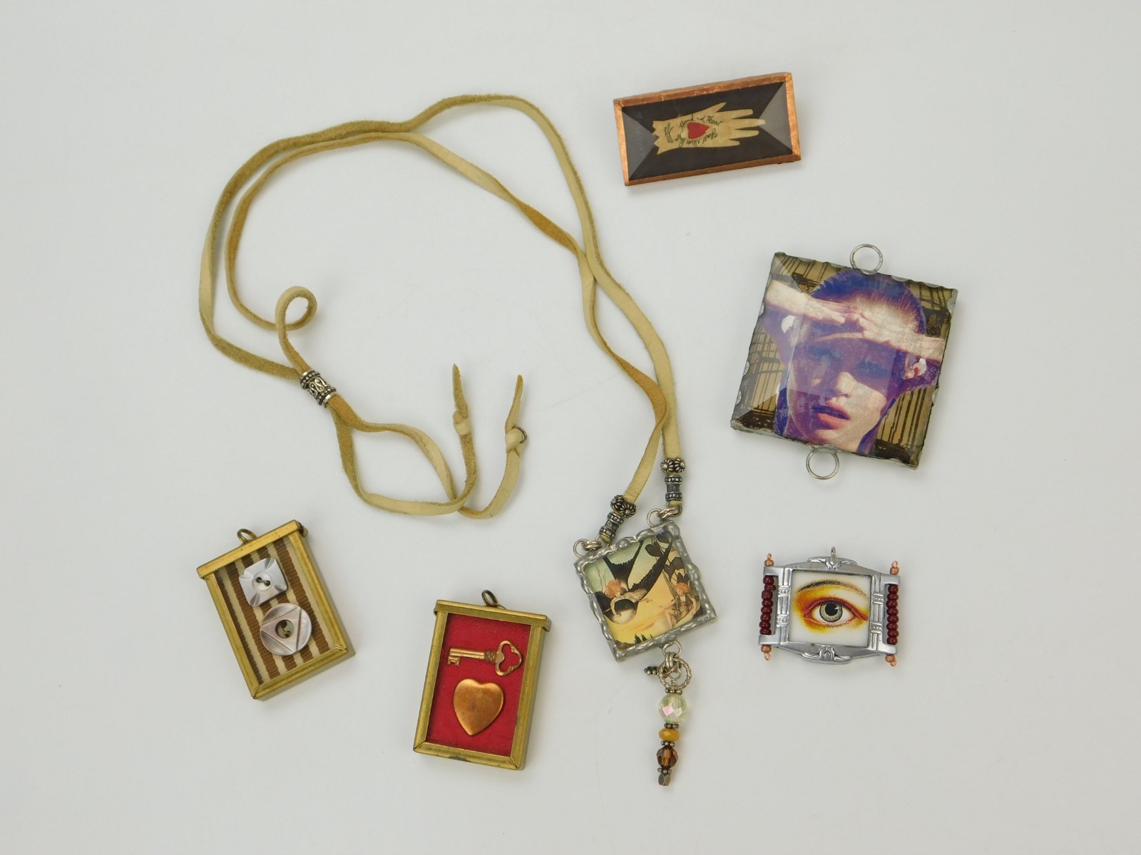 Lot of Artisan Made Jewelry Necklace Pendants Brooch Glass Eyes Hands Keys Birds