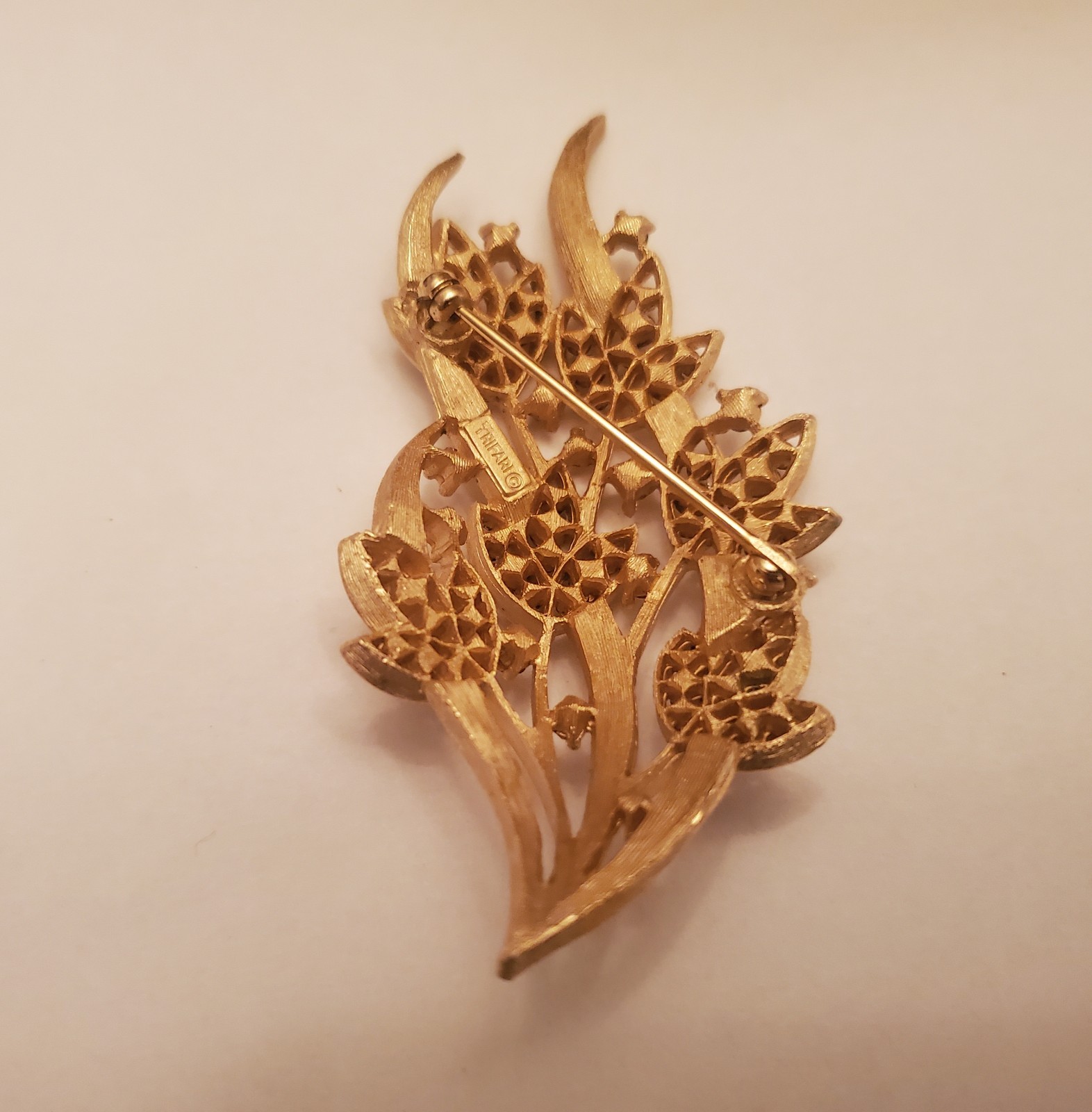 Vintage Trifari Brooch Features Floral Bouquet Design Crafted From Gold-Toned…
