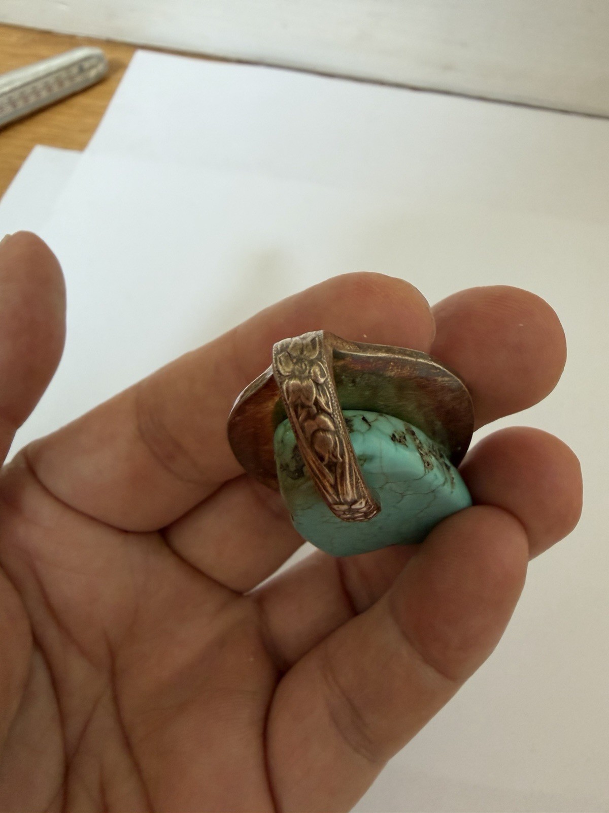 Beautiful silver pendant featuring a turquoise stone set on a decorative bail B5