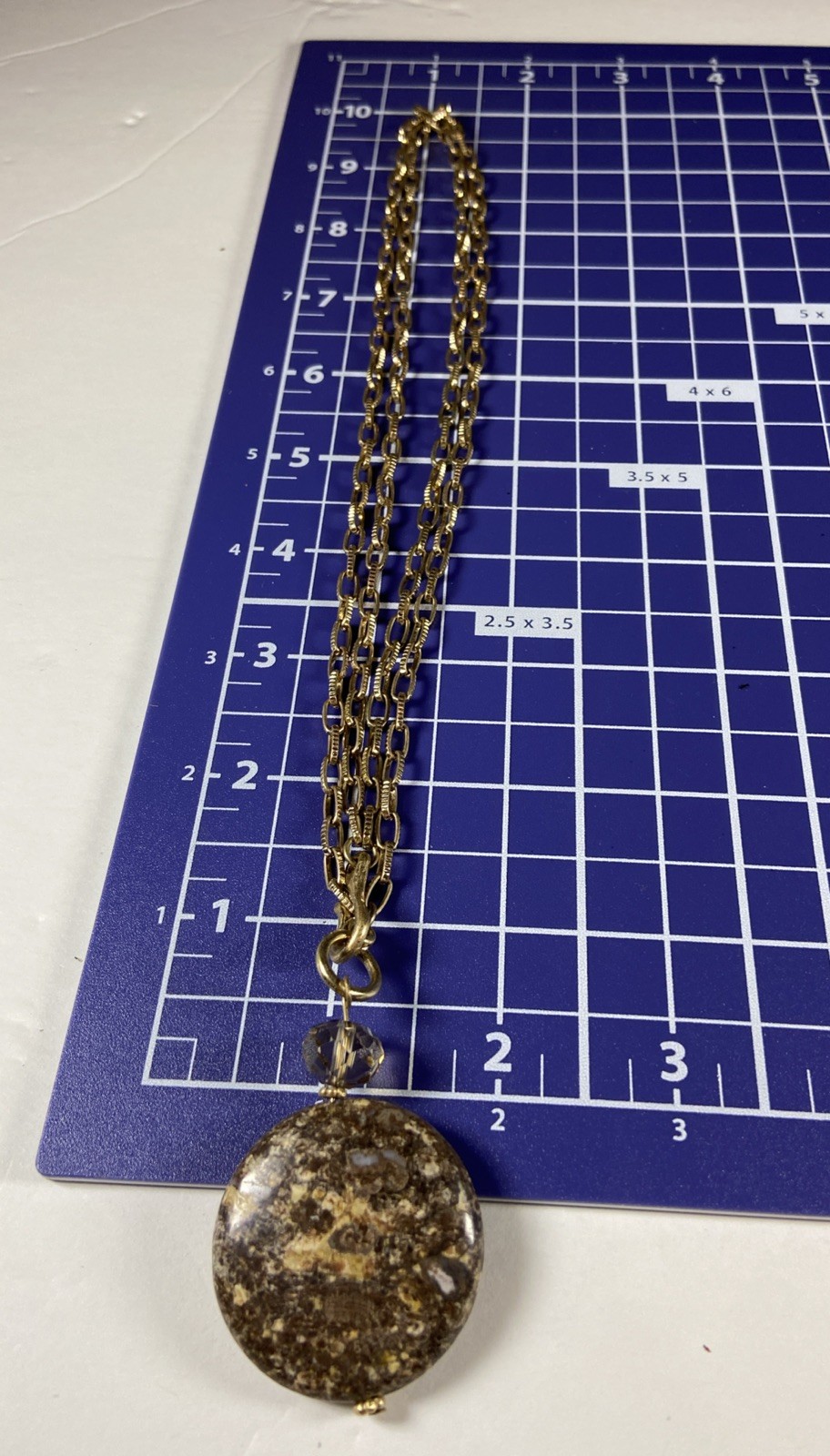 Gold Tone Medallion Necklace With Brown Stone Pendant