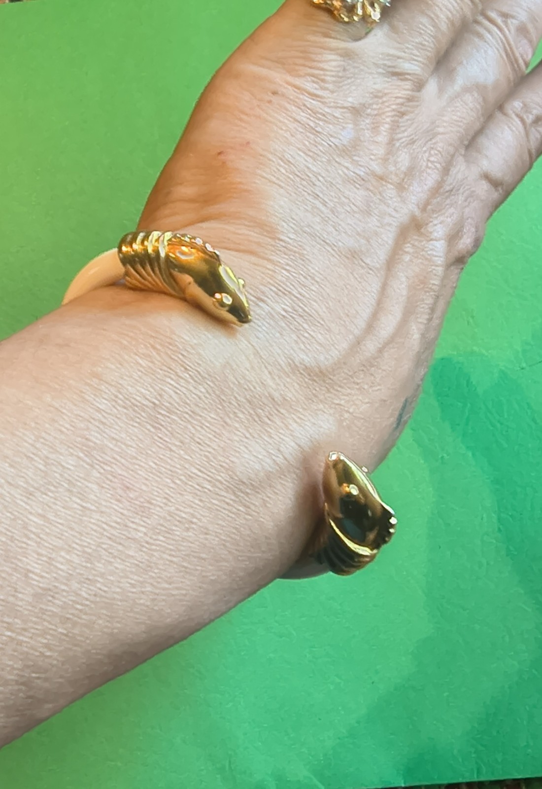 Signed Monet vintage bracelet with a bright gold-tone finish.