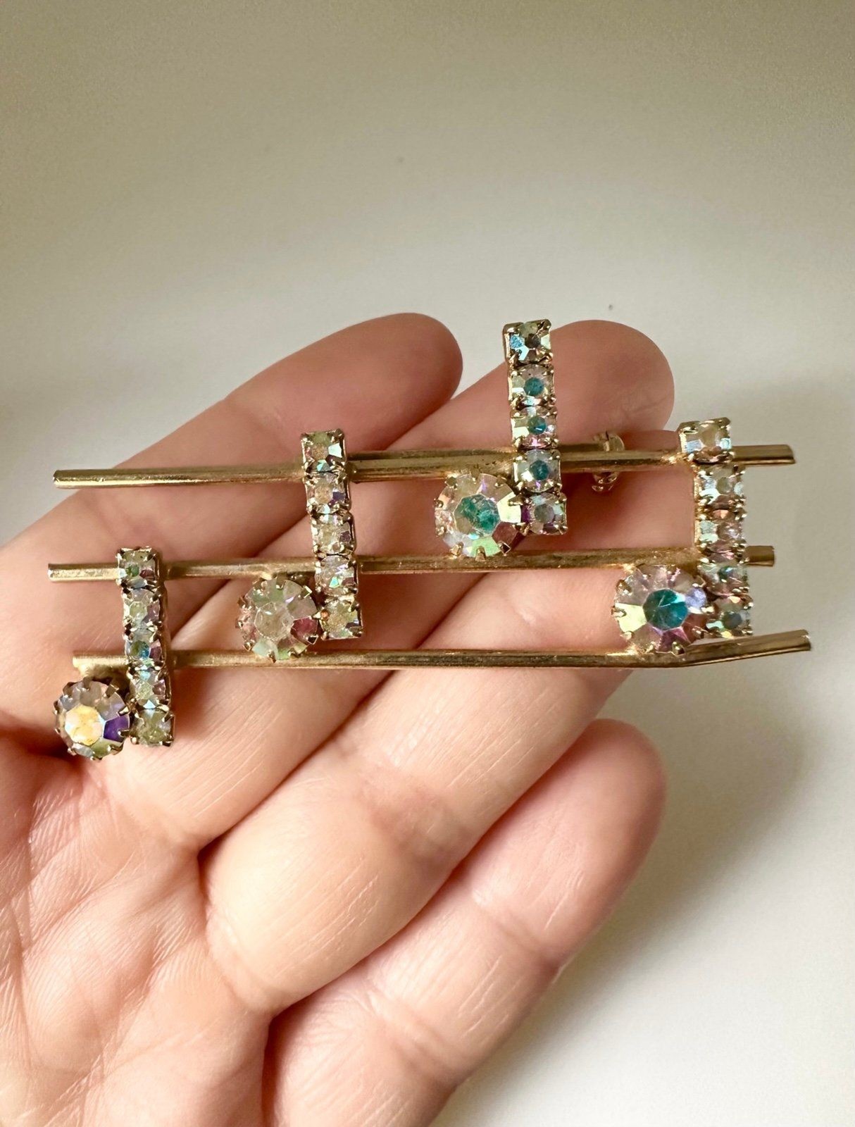 Vintage gold tone rhinestone music notes brooch