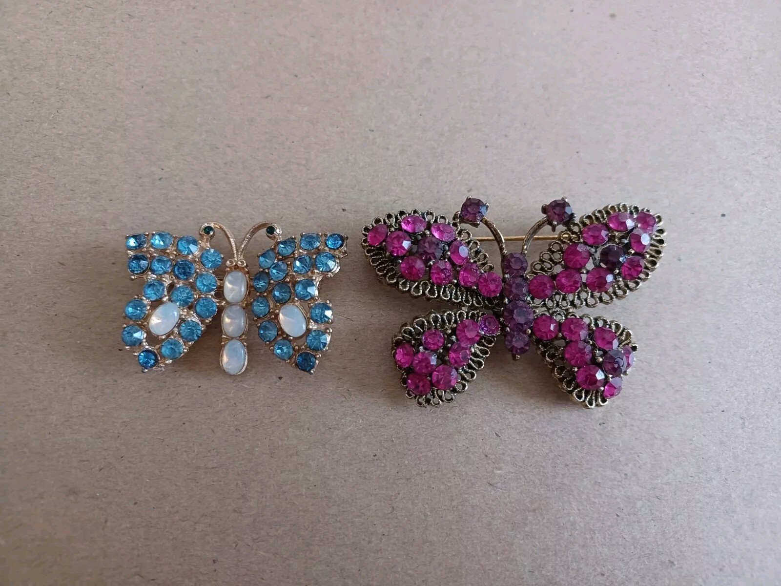 Vintage Lot Of 2 Rhinestone Butterfly Pins Brooches Pink Purple And Blue Milky
