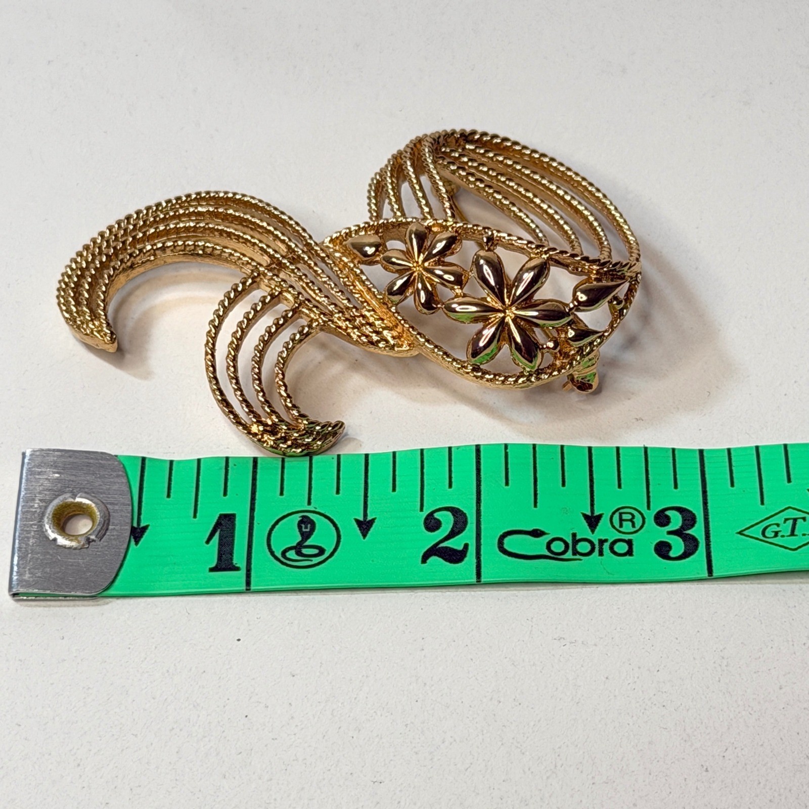 Monet Gold Tone Swirl Ribbon Flower Brooch Vintage Textured Floral Pin