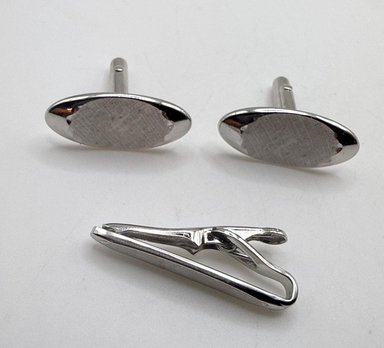 Vintage Swank silver tone textured elongated oval cuff links and tie clip set