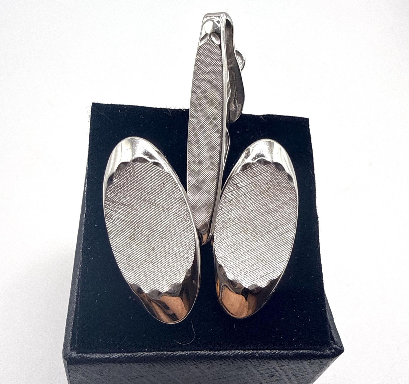Vintage Swank silver tone textured elongated oval cuff links and tie clip set