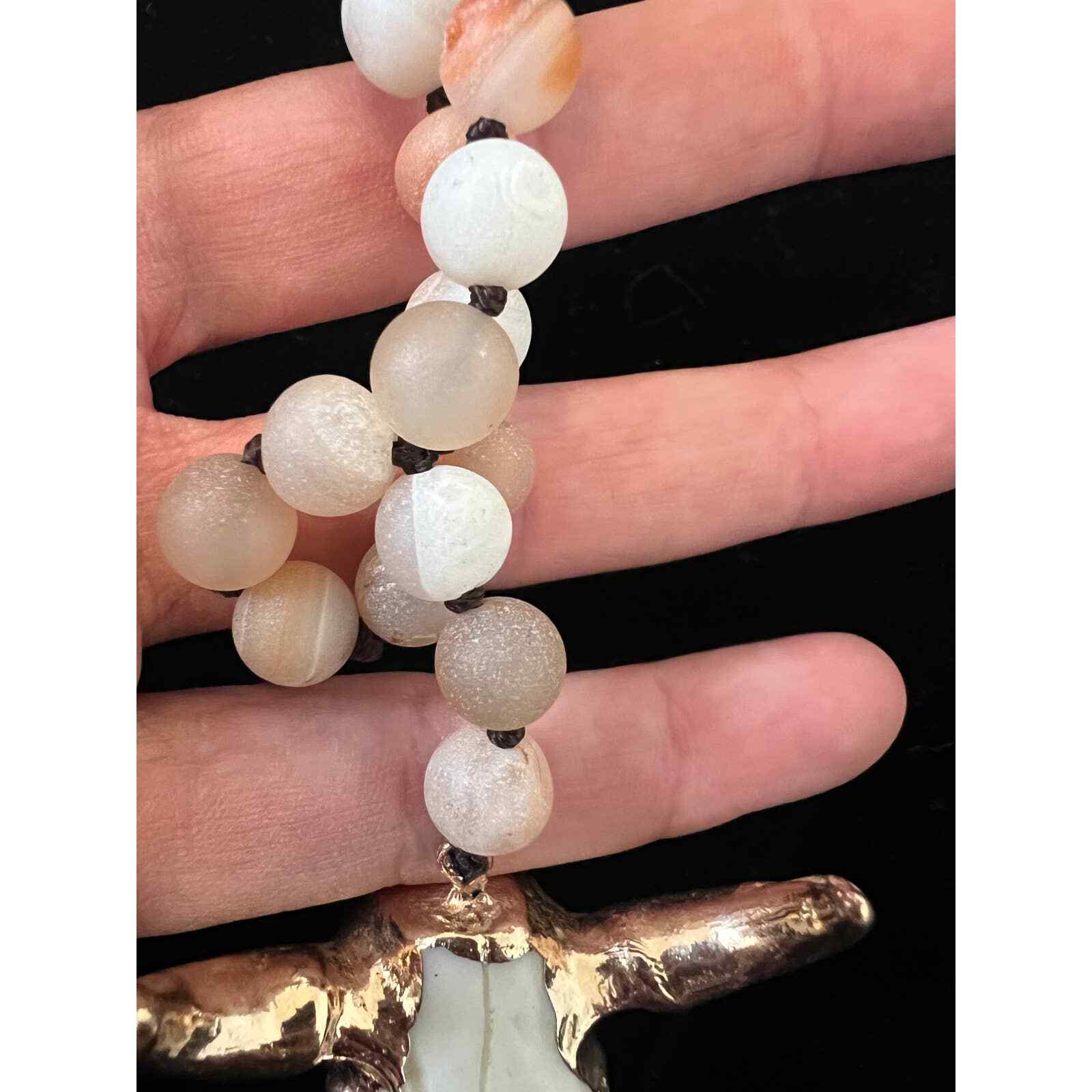 Hand knotted Bull necklace. Beads are either glass or real stones I’m not sure.