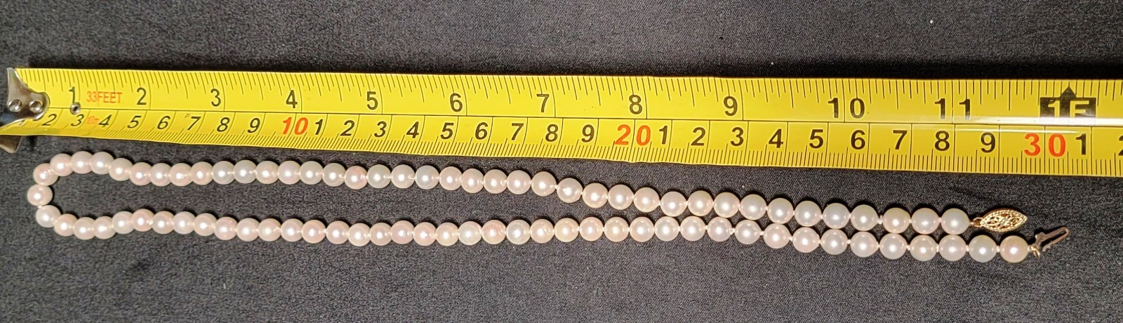 Vintage Pearl Necklace 6.9mm Pearls and 14K Gold Clasp 23.5 in Matinee Length