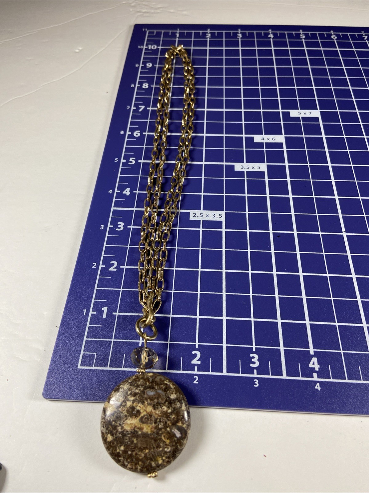 Gold Tone Medallion Necklace With Brown Stone Pendant