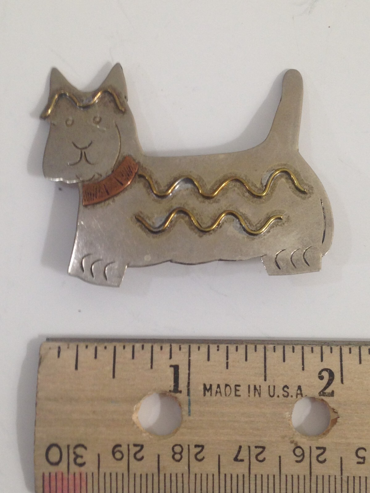 3 brooches – 1 Avon heart w/bow , 1 Pisatelli swoop, 1 unbranded scotty dog lot