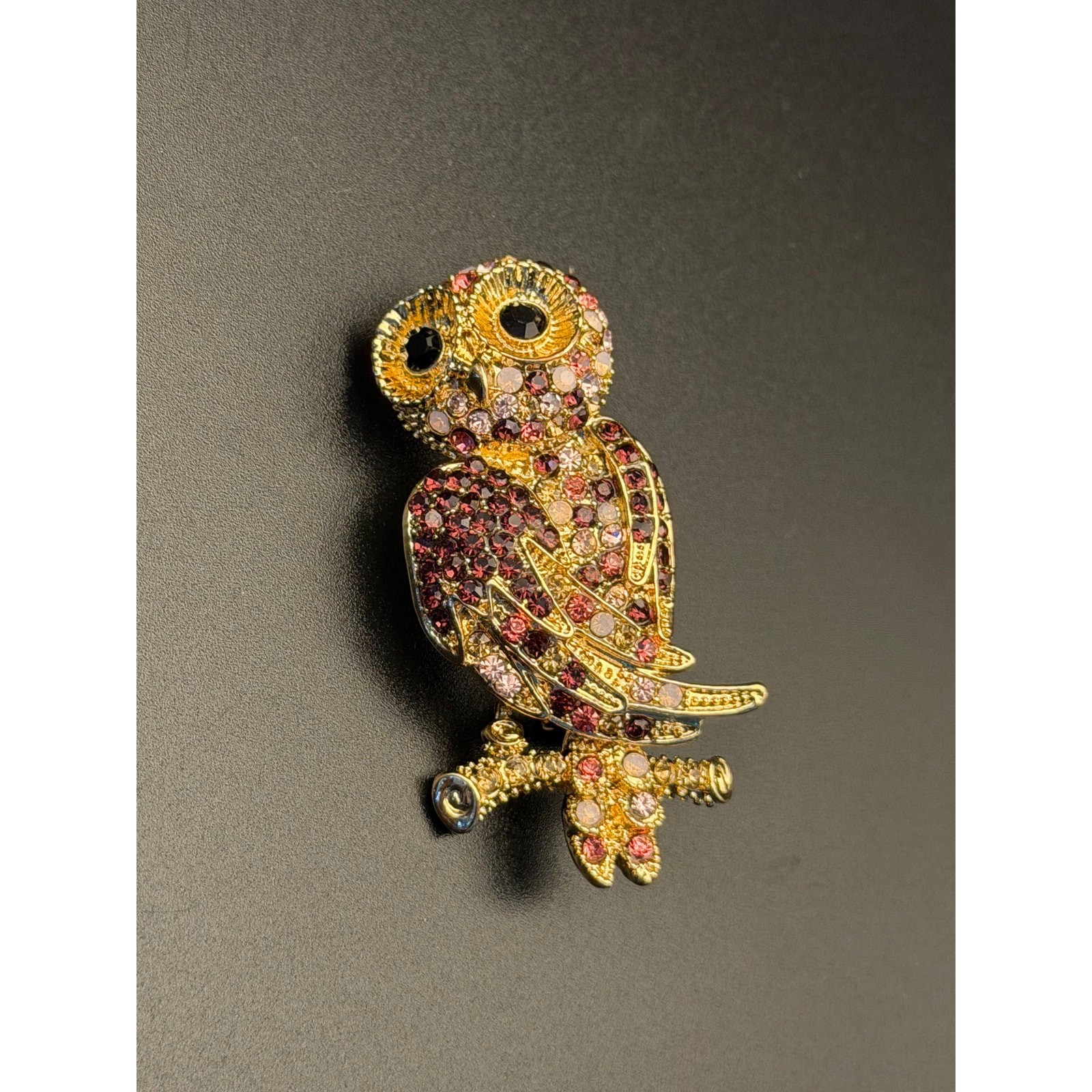 Vintage Monet gold-tone rhinestone owl brooch with purple, pink, white stones