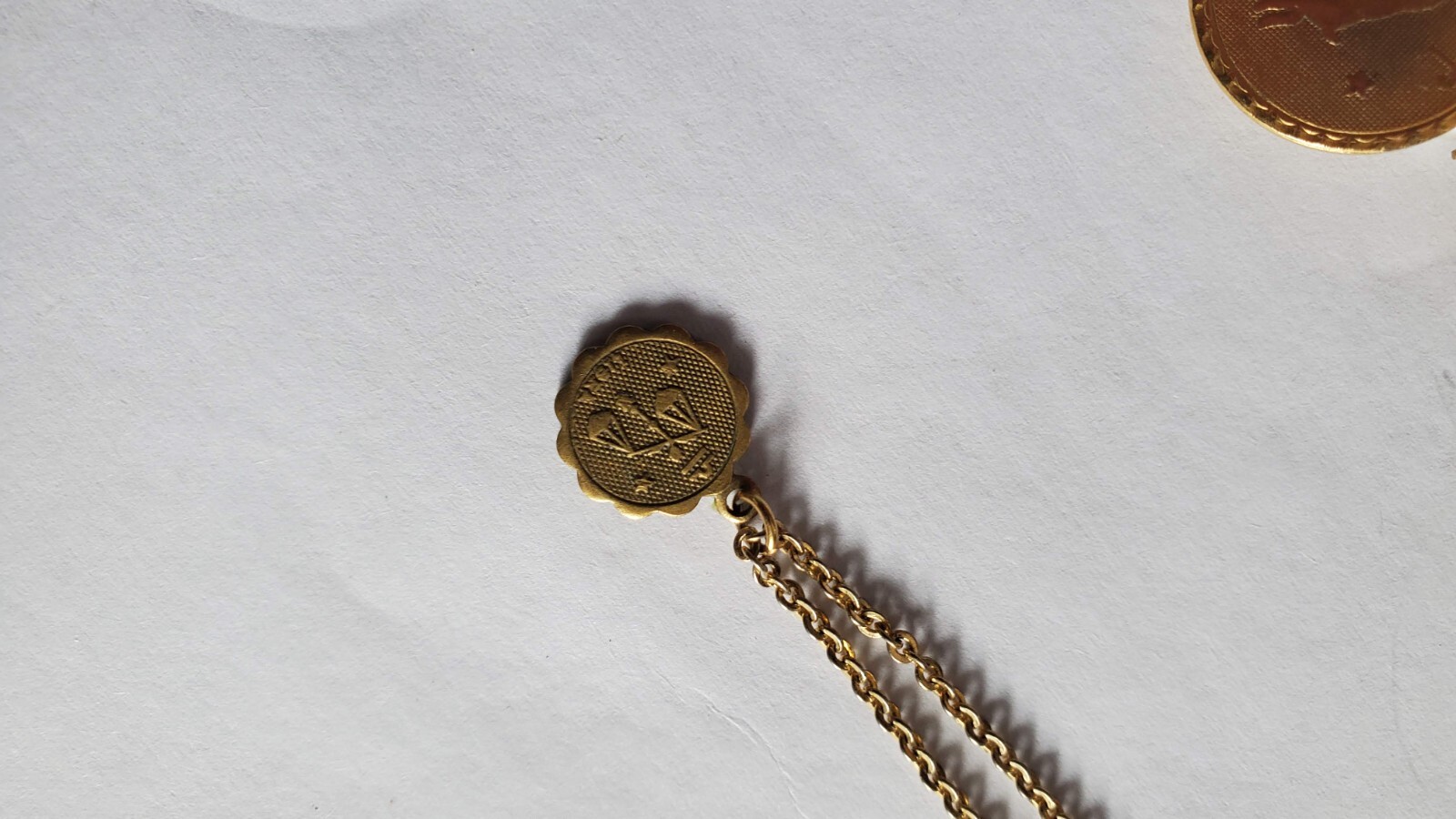 Vintage two gold tone zodiak necklaces, one designer’s Danielle Stevens