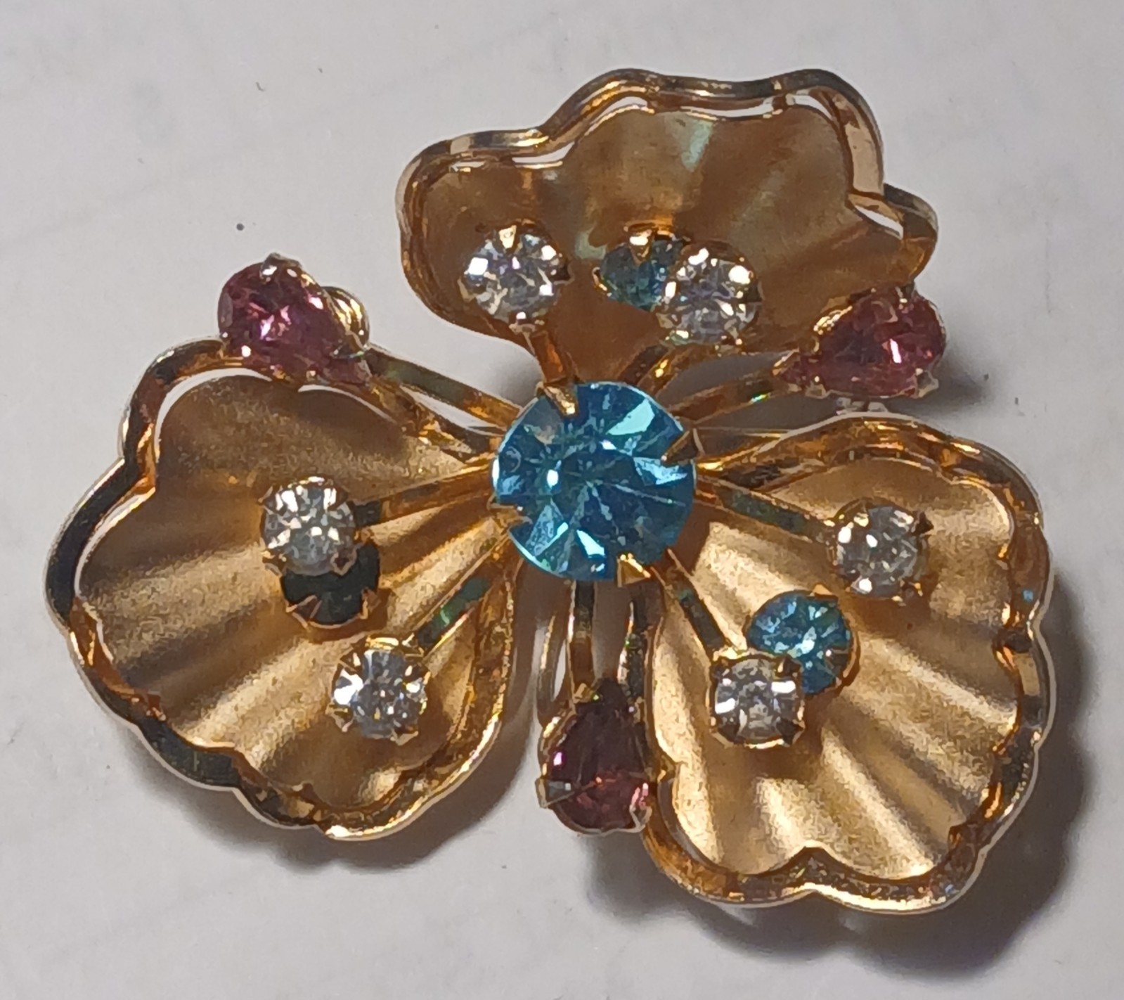 Vintage flower brooch/ pin with multi color rhinestones in gold metal setting