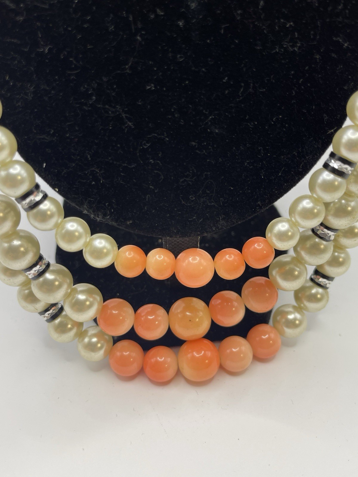 Vintage ivory and coral triple strand pearl necklace with gold tone clasp 20”