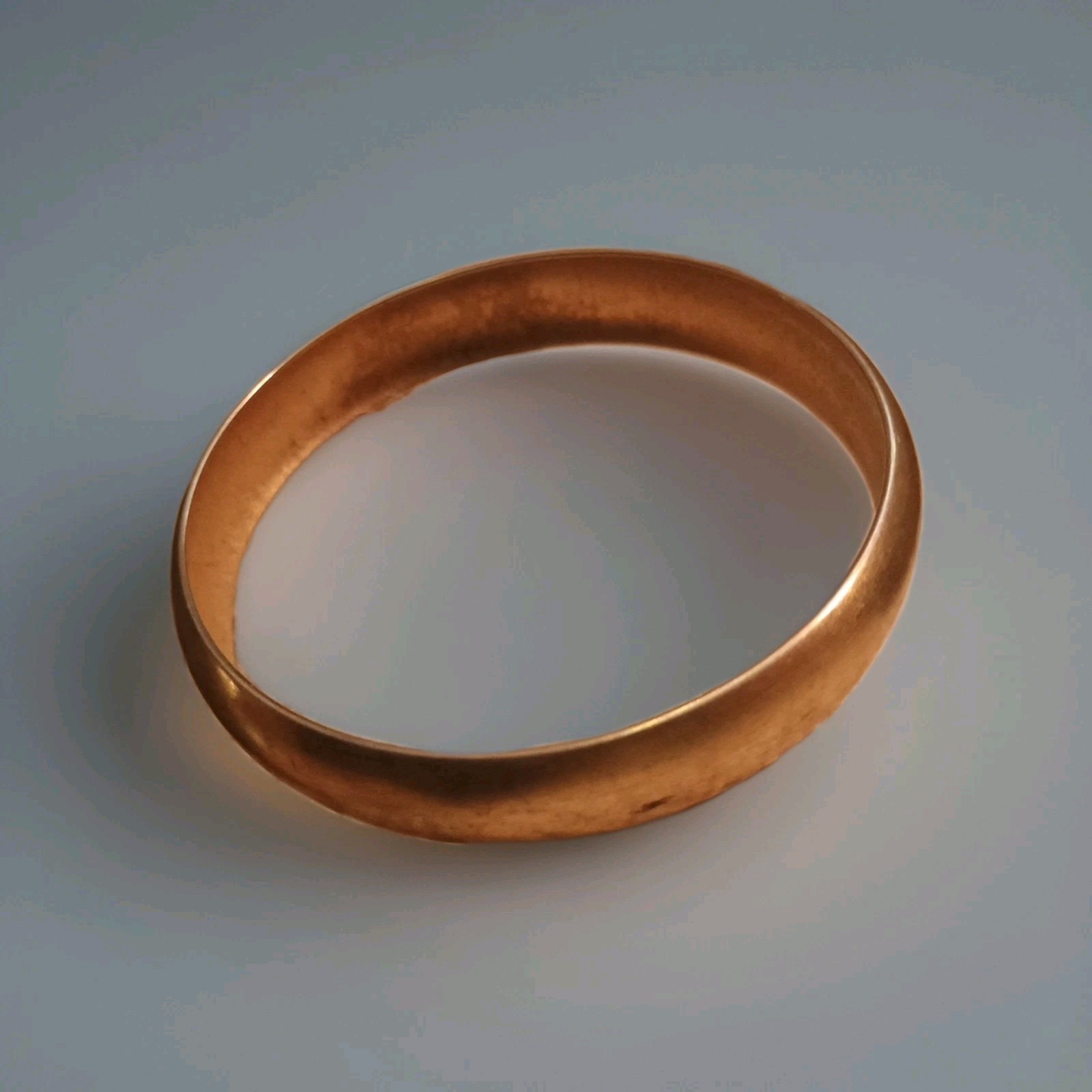 Monet polished gold-tone bangle bracelet. Solid plain finish, vintage