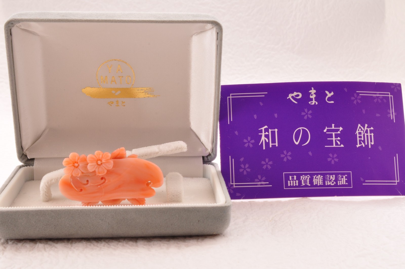 Vintage pink coral OBIDOME carved “cherry blossoms” Certificate, (total 64.0ct).