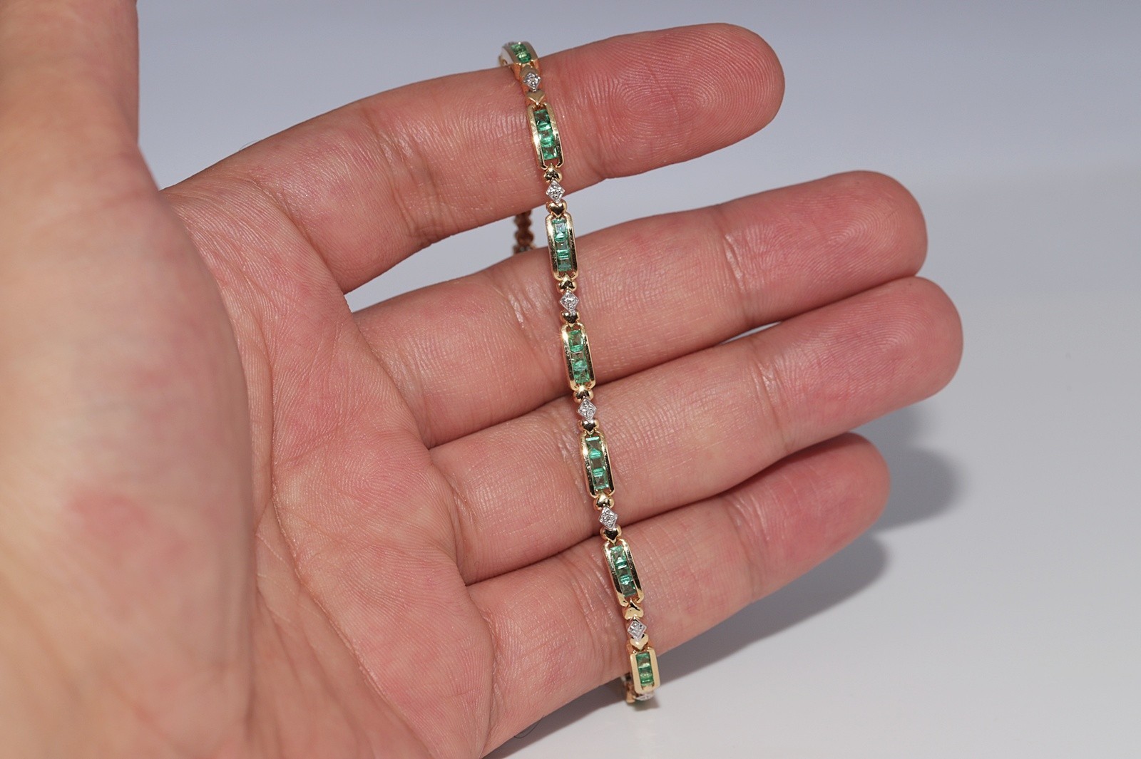 Vintage Circa 1980s 18k Gold Natural Diamond And Caliber Cut Emerald Bracelet