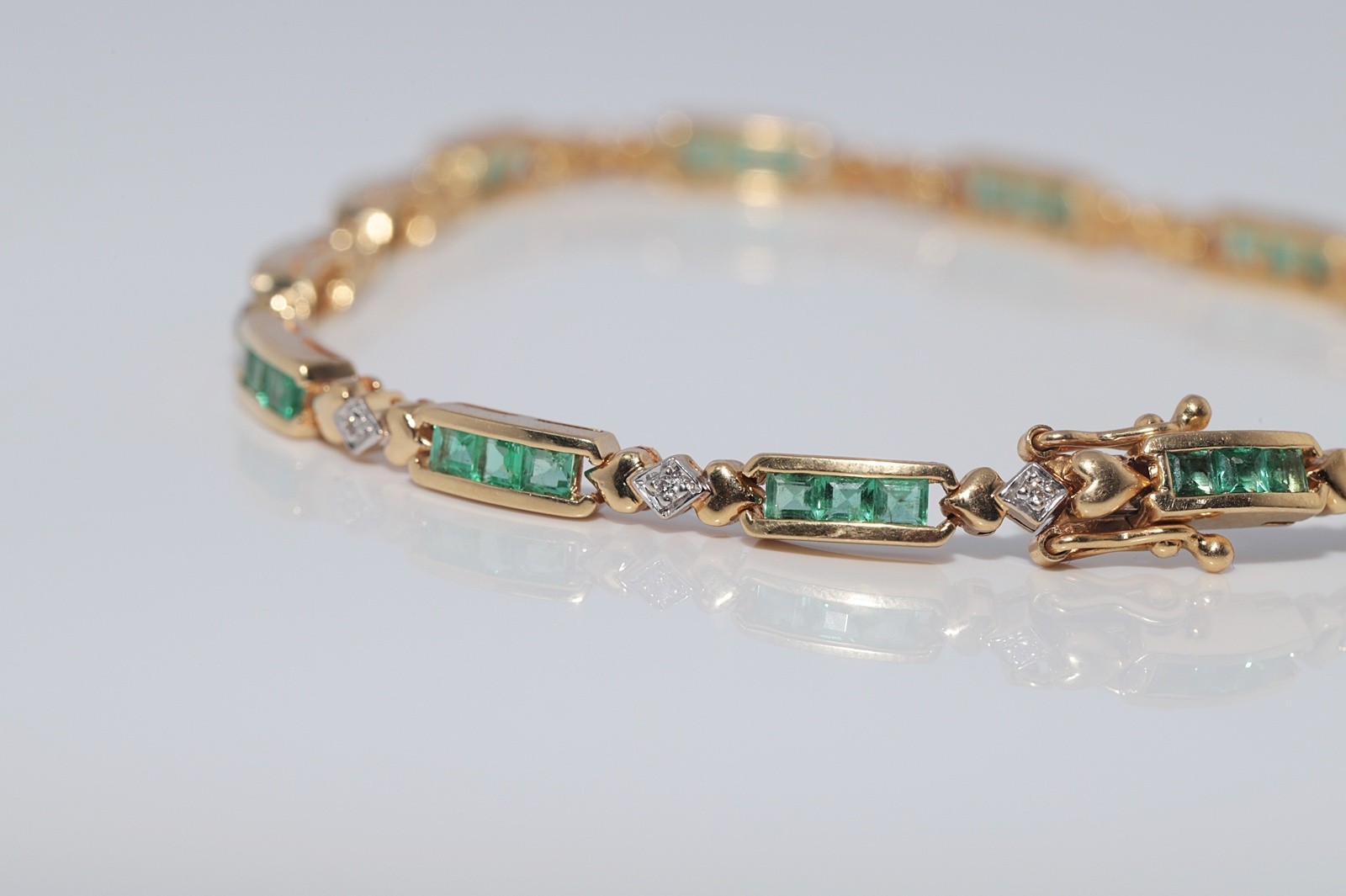 Vintage Circa 1980s 18k Gold Natural Diamond And Caliber Cut Emerald Bracelet