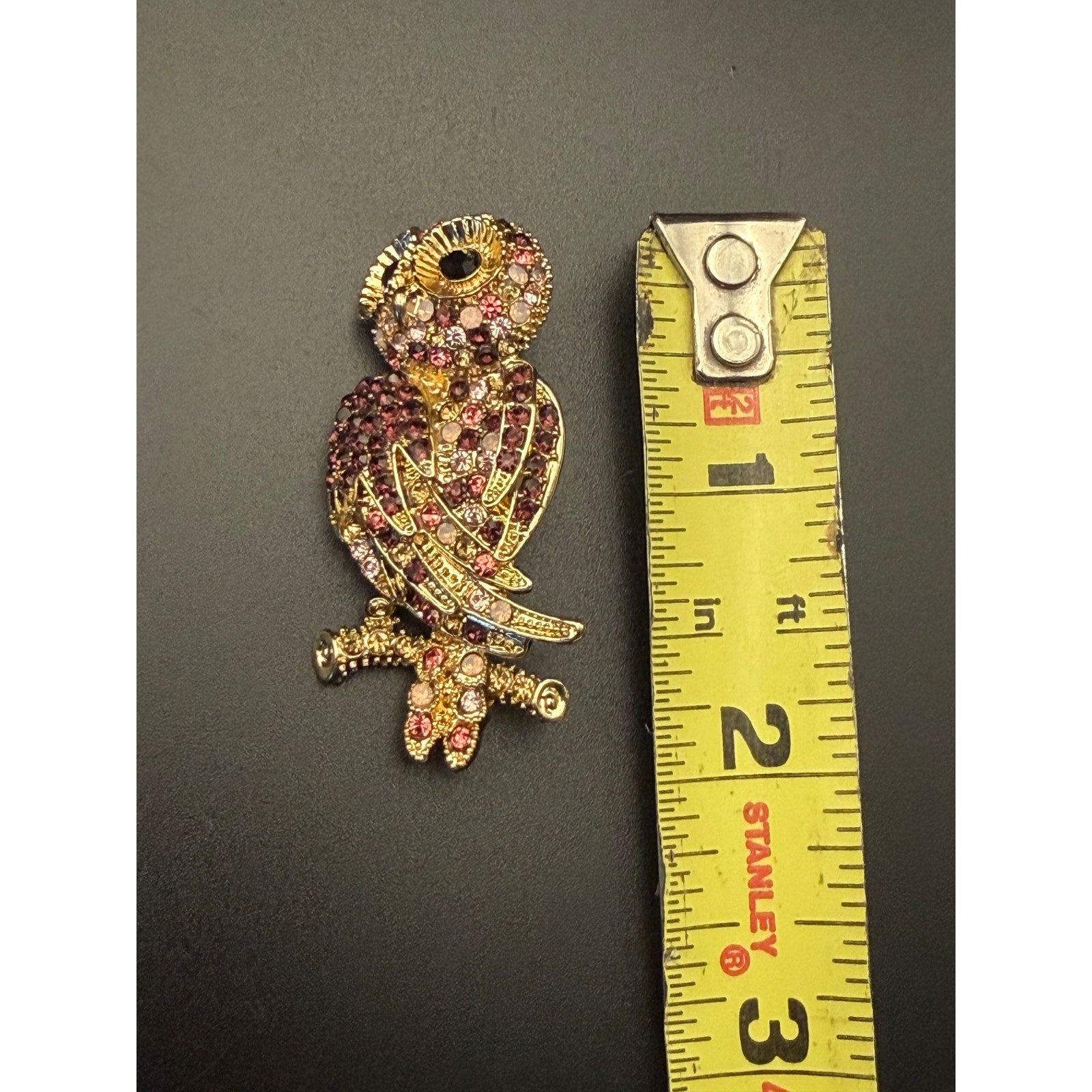Vintage Monet gold-tone rhinestone owl brooch with purple, pink, white stones