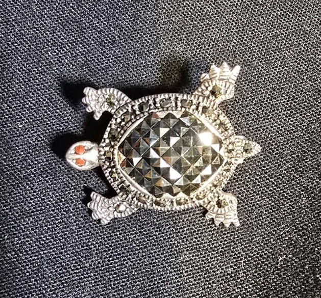 Sterling Silver Turtle Brooch features Marcasite Accents and Red Coral Eyes