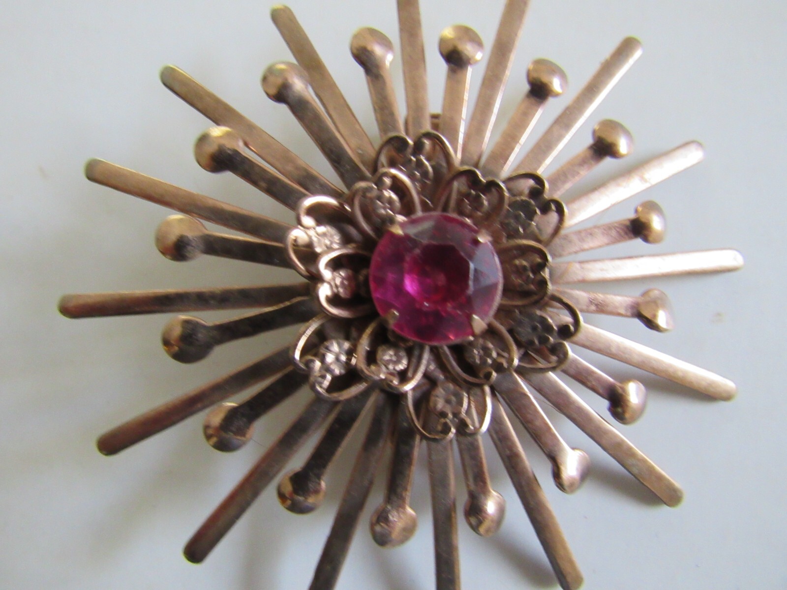 Unbranded Rose Gold Color Starburst Brooch / Pin w Pink Center Stone Vintage