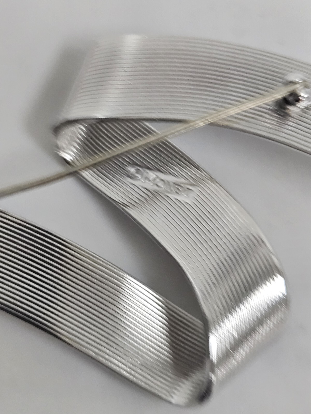 Vintage Monet Silver Tone Swirl Ribbon Pin Signed Mid Century Modern