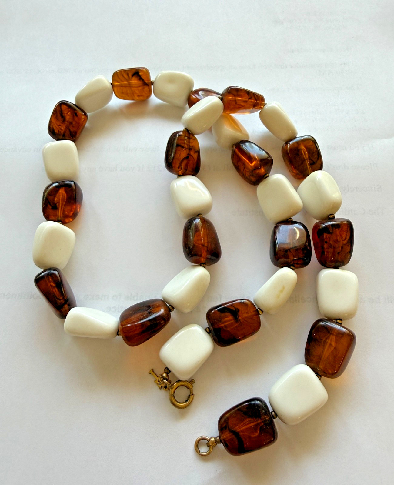 Vintage brown and white thermoset bakelite or lucite 24″ necklace Crown Trifari