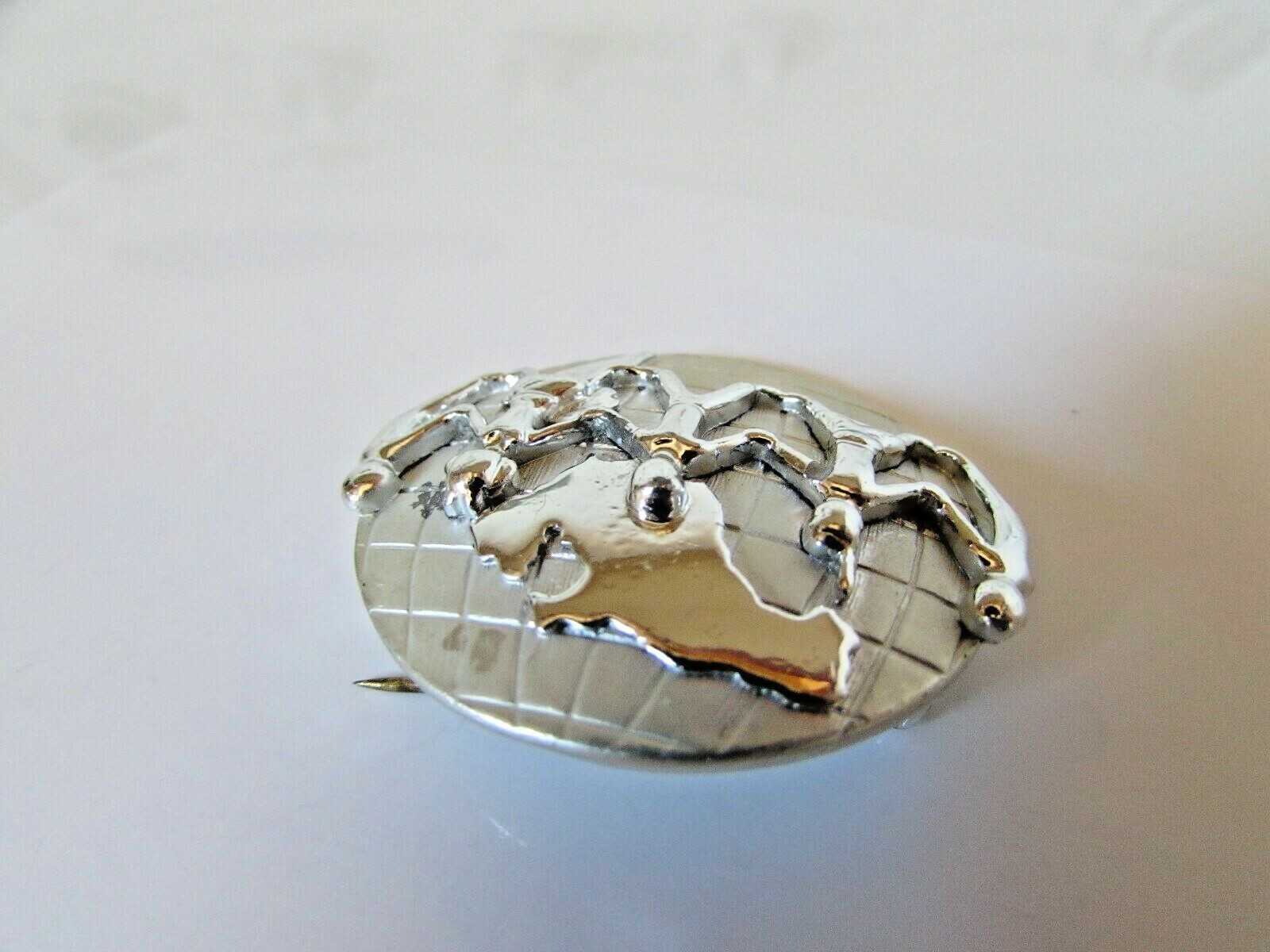 Vintage AJC Signed Silver Tone Holding Hands Across the World Brooch Pin 1 1/2″